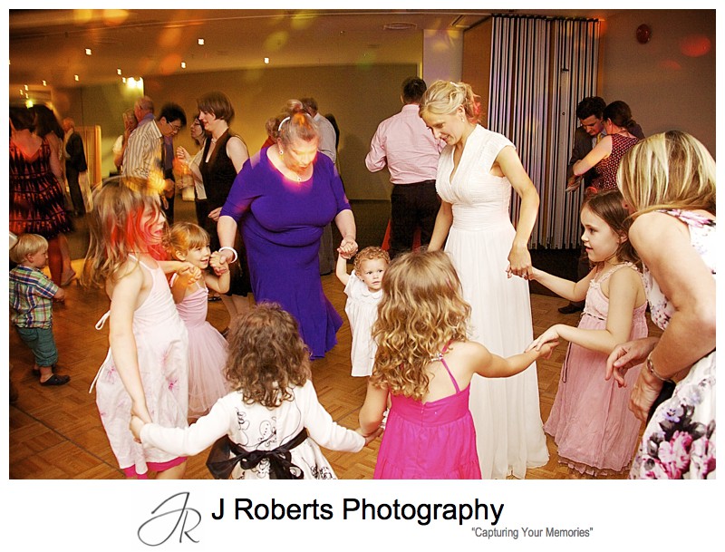 Little girls dancing at wedding reception Taronga zoo Function centre - wedding photography sydney